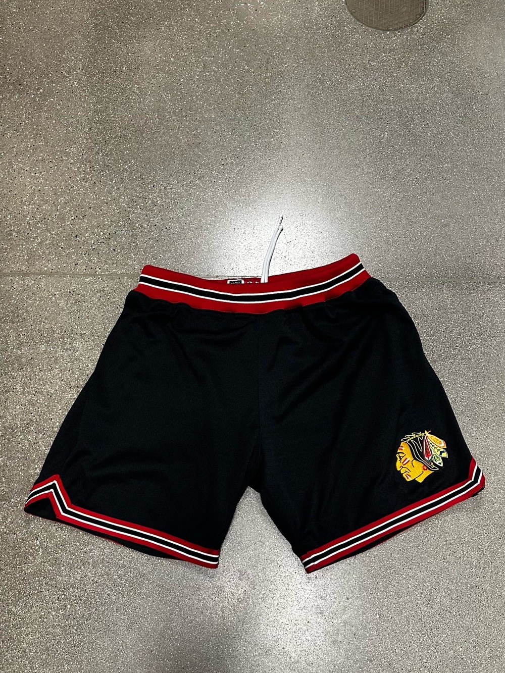 Mitchell & Ness Black Athletic Shorts with Red and White Trim and Team Crest